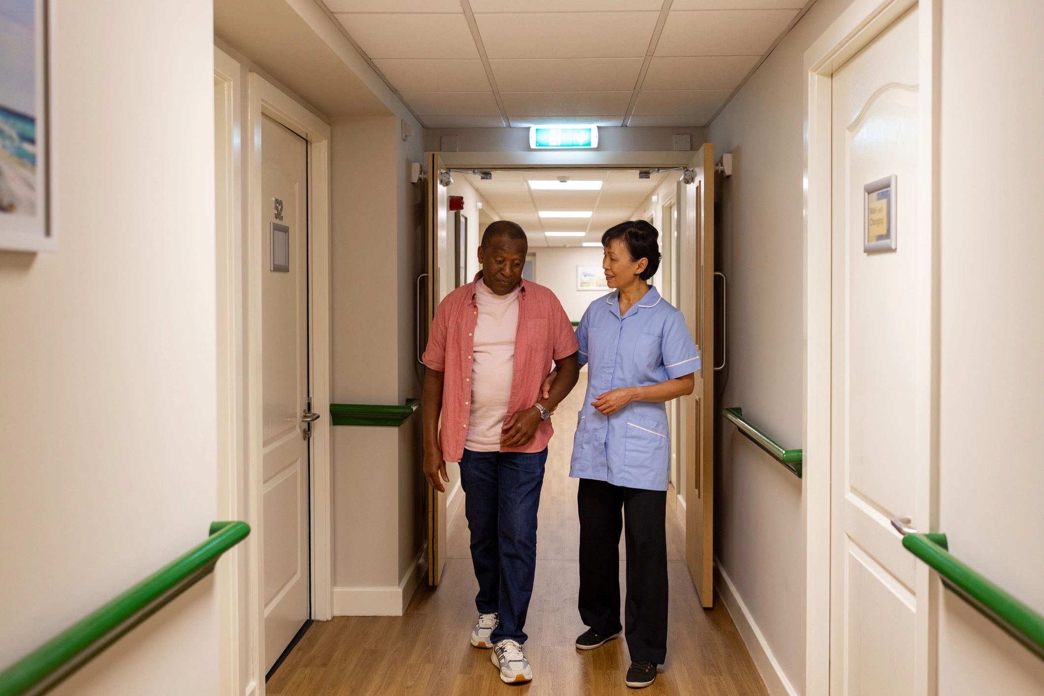 Care worker supporting a resident representing live-in care