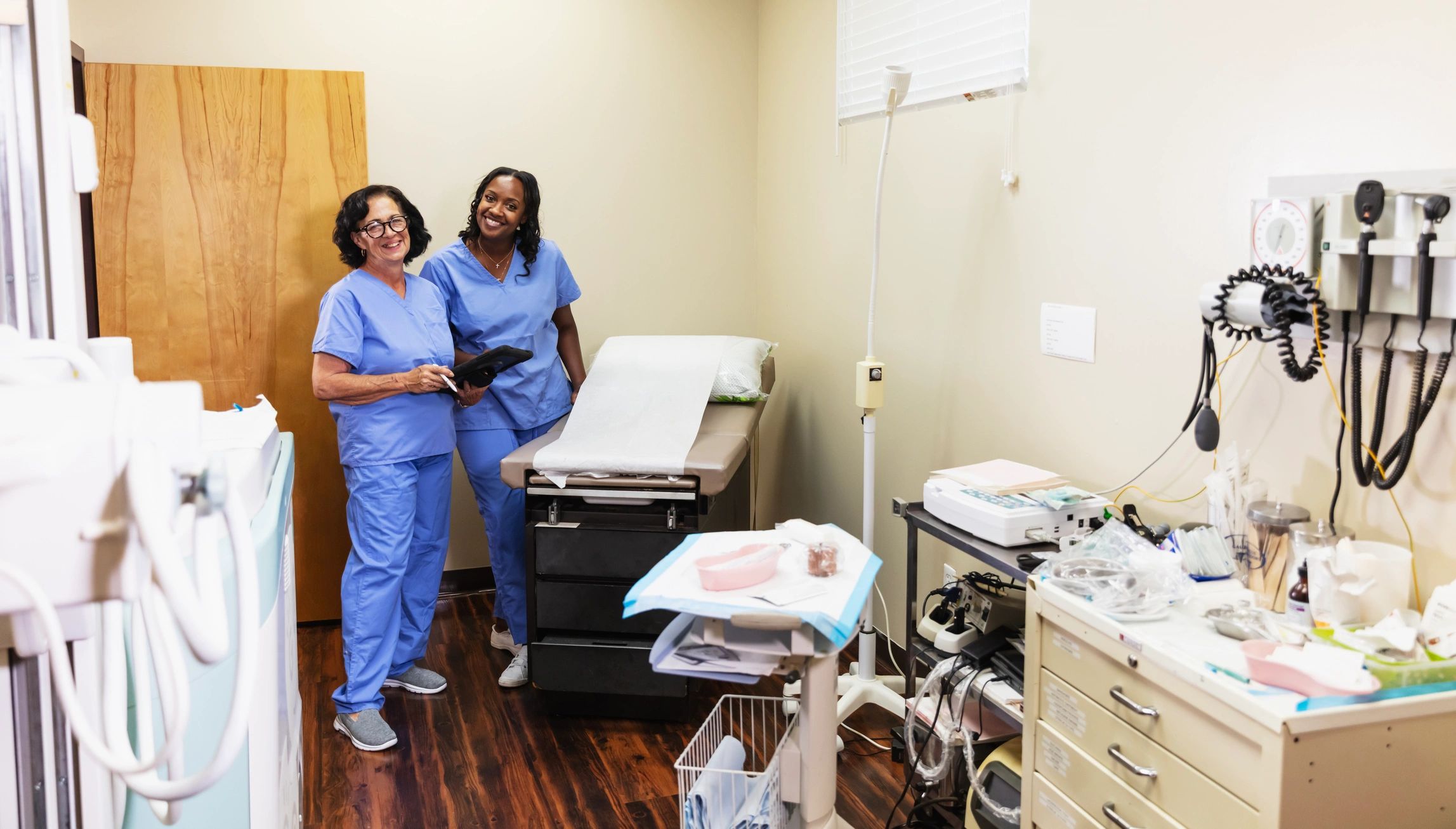 Healthcare workers in an examination room