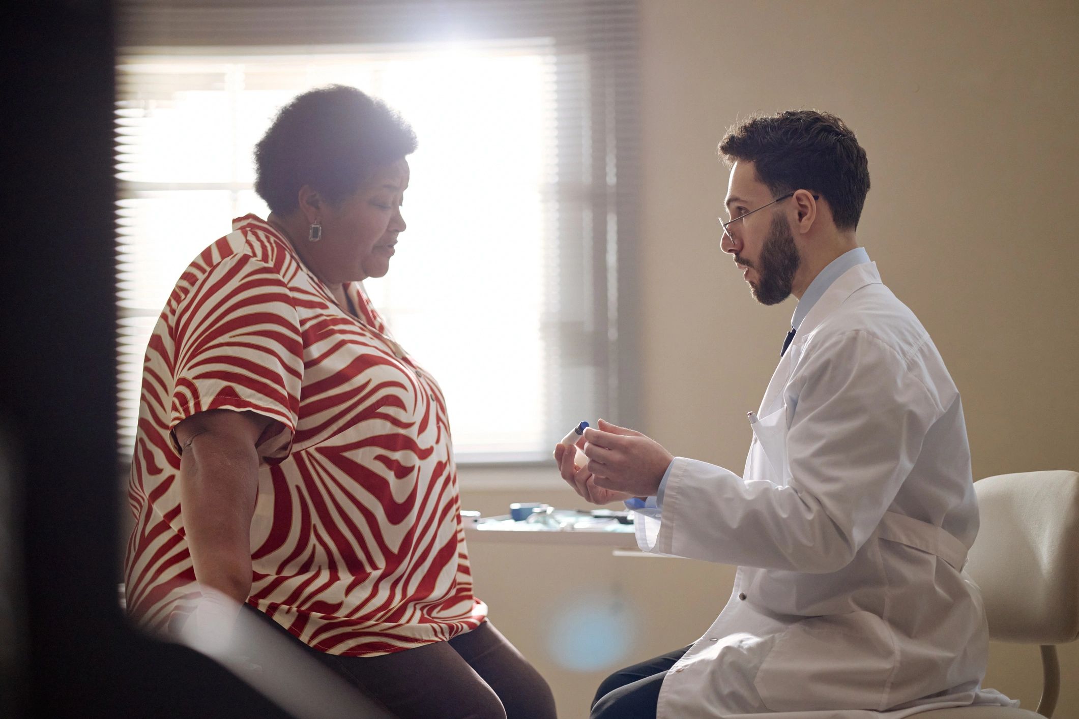Doctor consulting with a patient during a medical visit