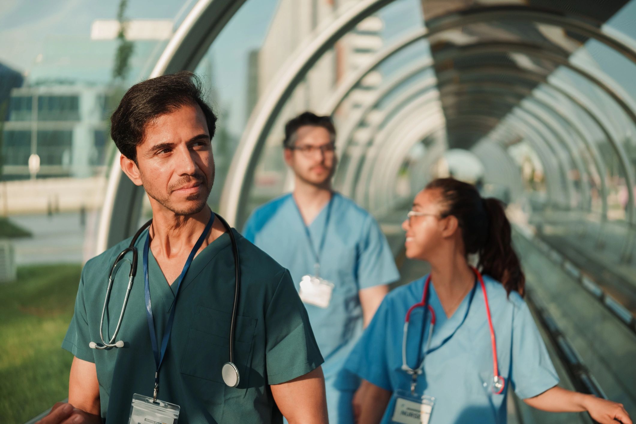 Medical professionals walking in a modern hospital corridor